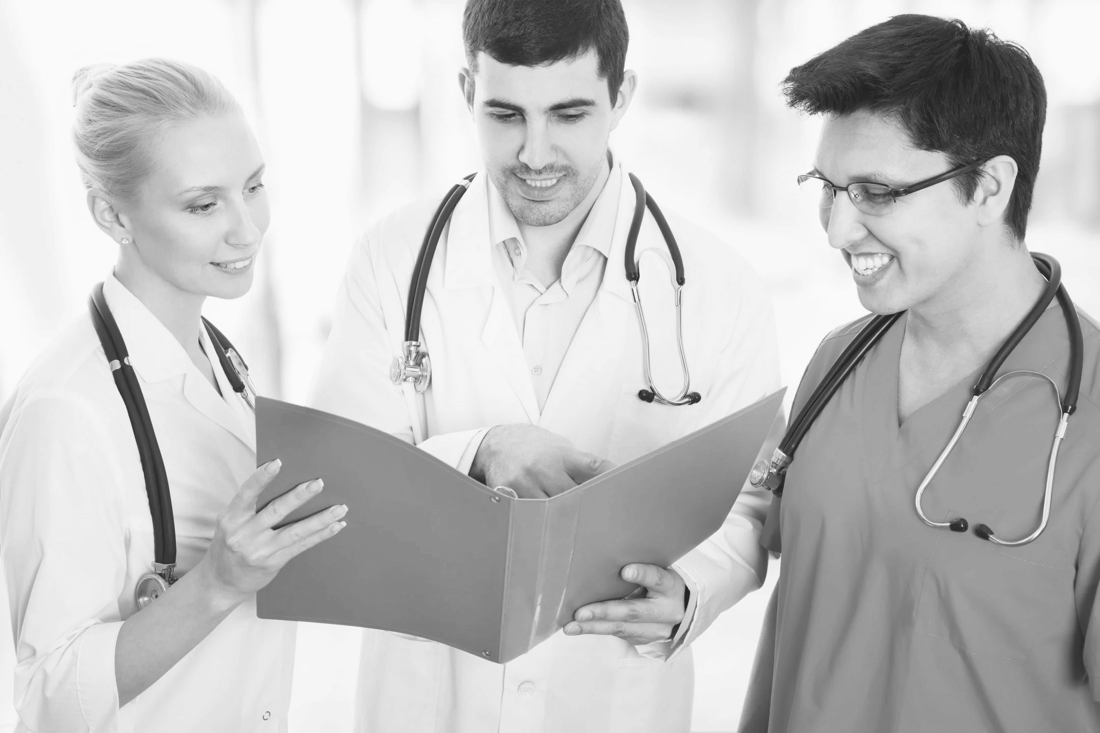 Clinicians reviewing a chart together
